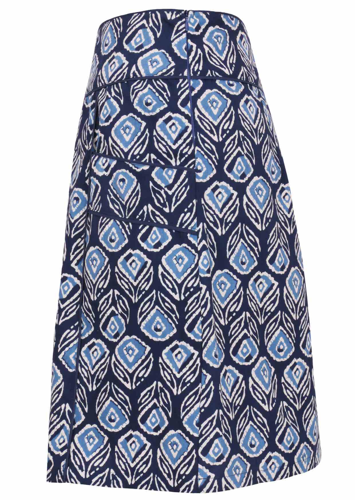 Side image of navy based floral print, A line cotton skirt with wide piped waistband, pockets and hidden side zipper