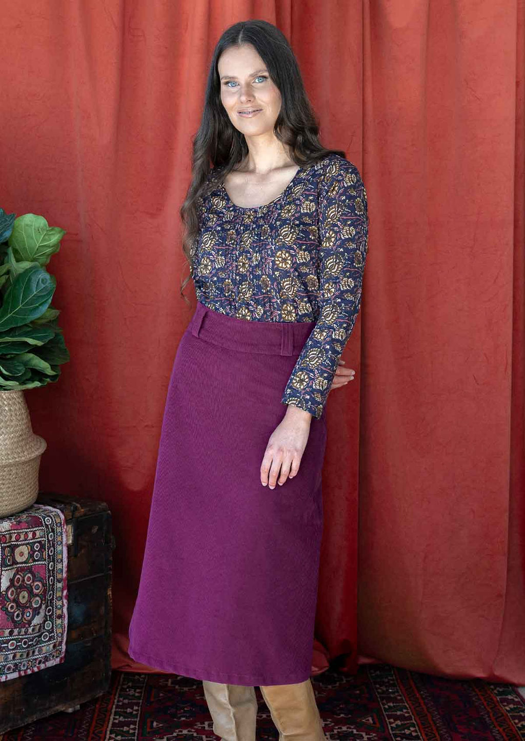 woman wearing purple corduroy aline skirt with purple cotton top