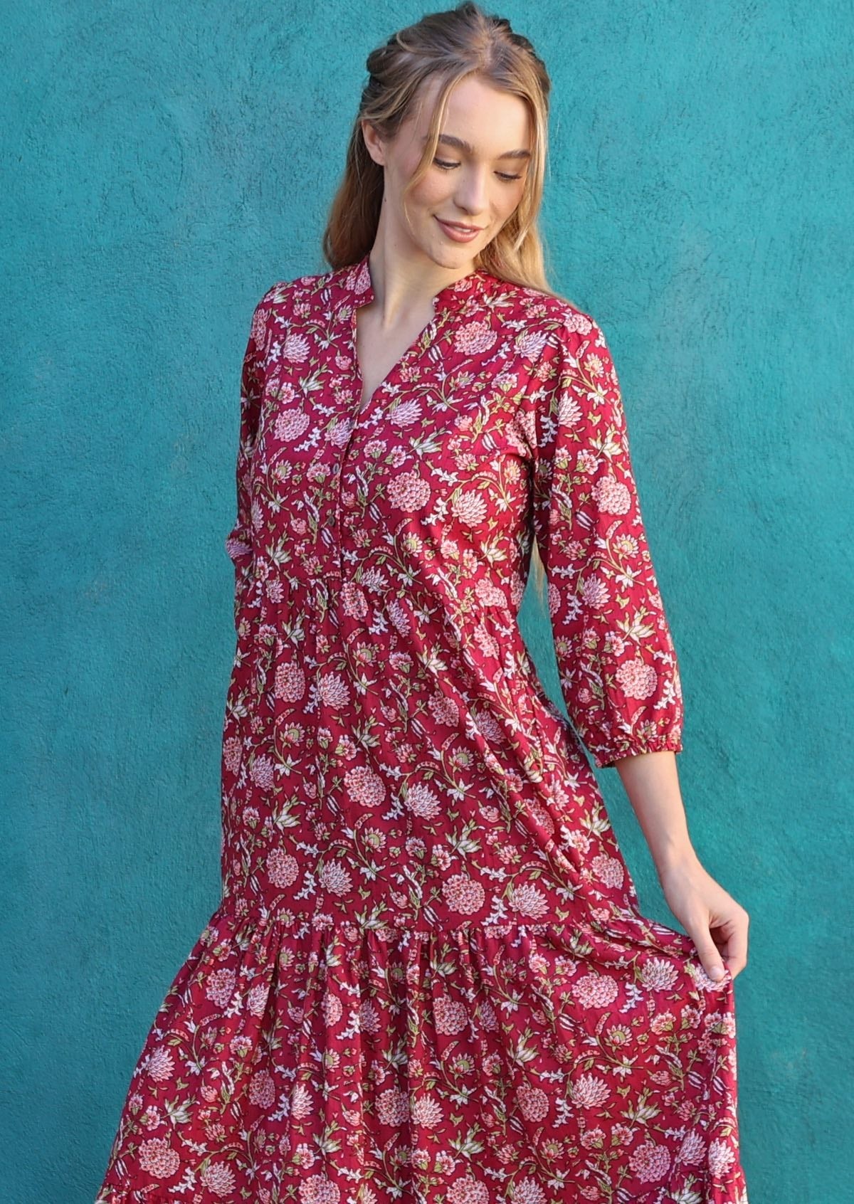 Close up of woman in floral print cotton maxi dress with buttoned bodice with V-neckline and mandarin collar