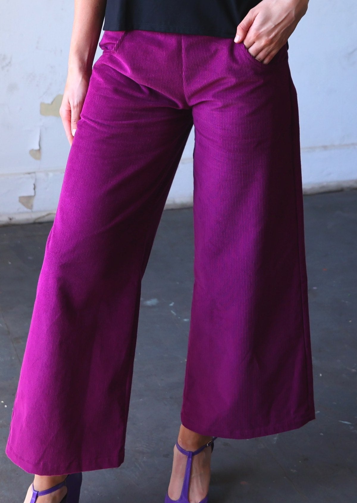 Close up of plum purple corduroy wide leg pants with pockets