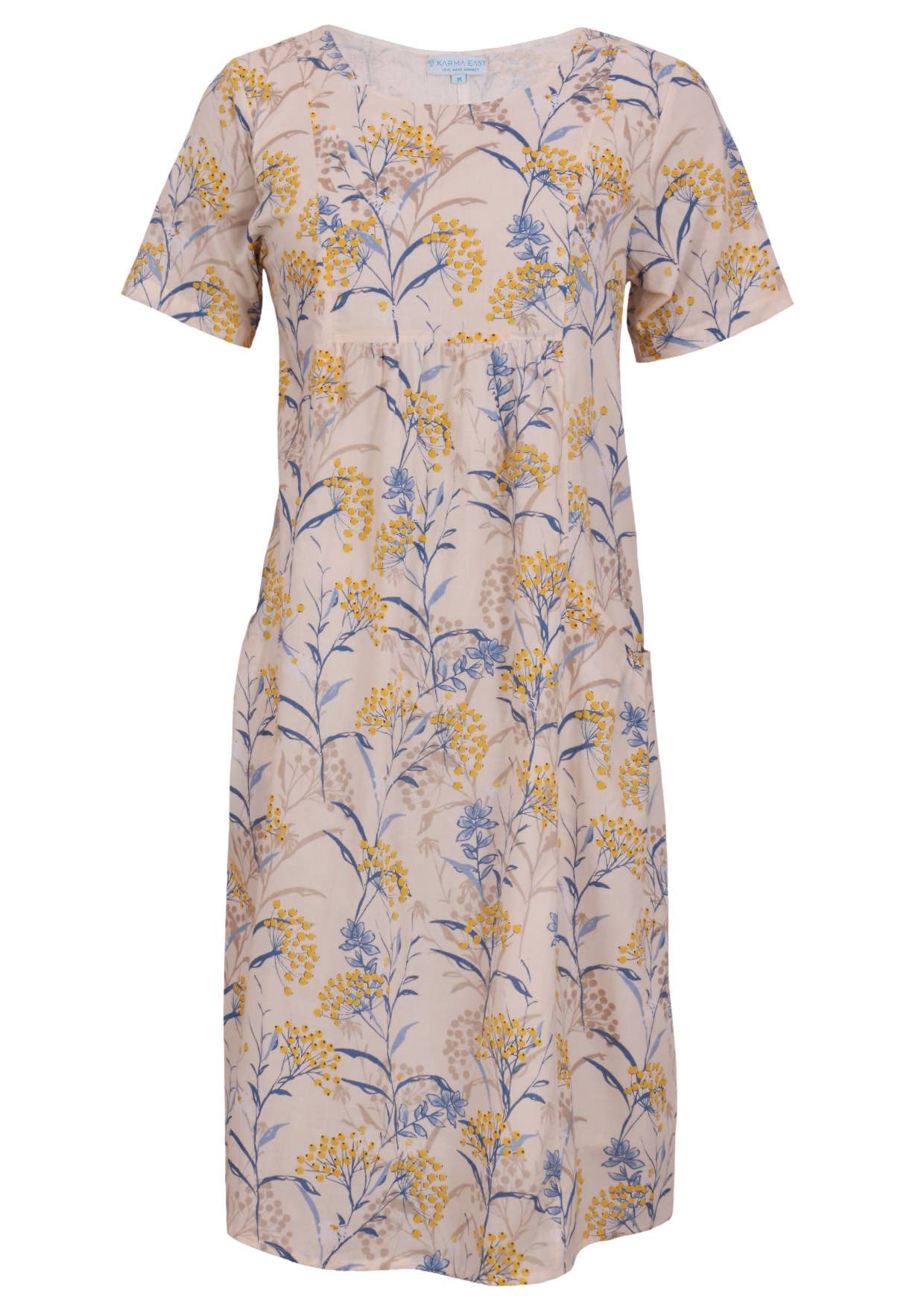 Front view of cotton dress with round neckline in neutral based floral print.