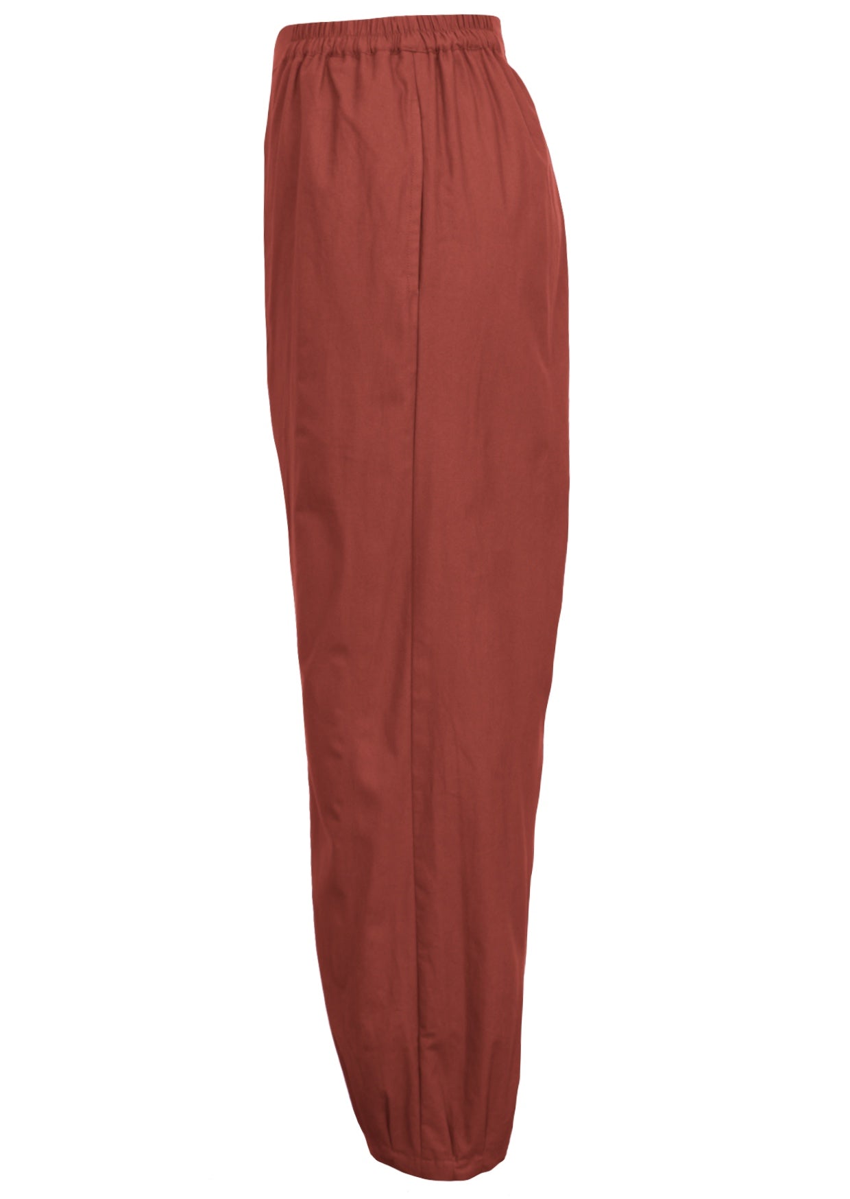 Side view of wide leg cotton harem pants in rust with pockets and pleated ankles