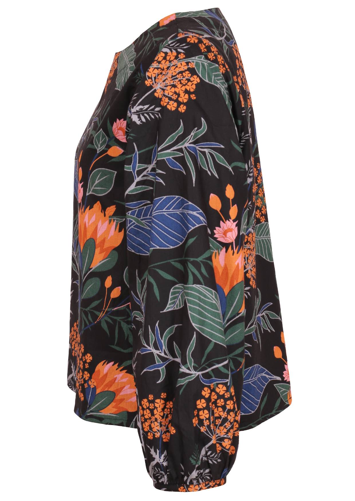 Side view of loose fitting, black floral 100% cotton top with bishop sleeves