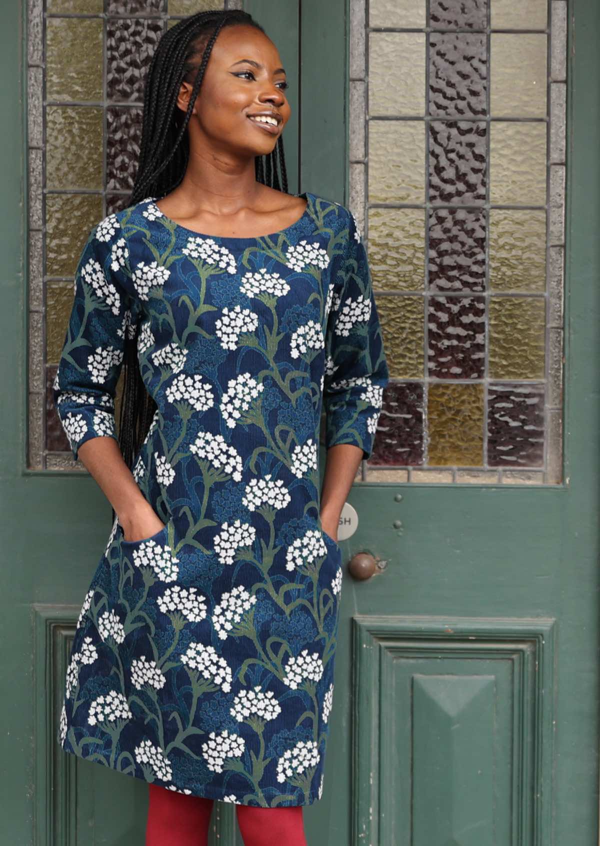 Woman wears gorgeous floral cotton corduroy 3/4 sleeve dress