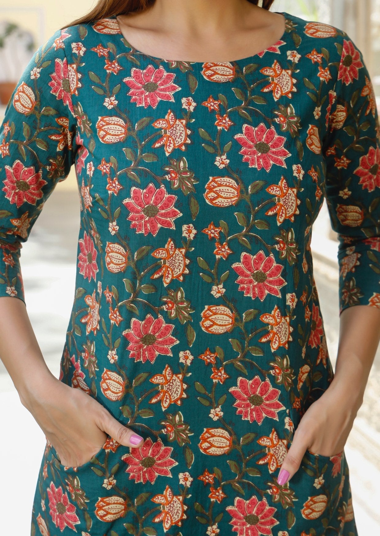 100% cotton dress with beautiful pinkish florals on deep green base.