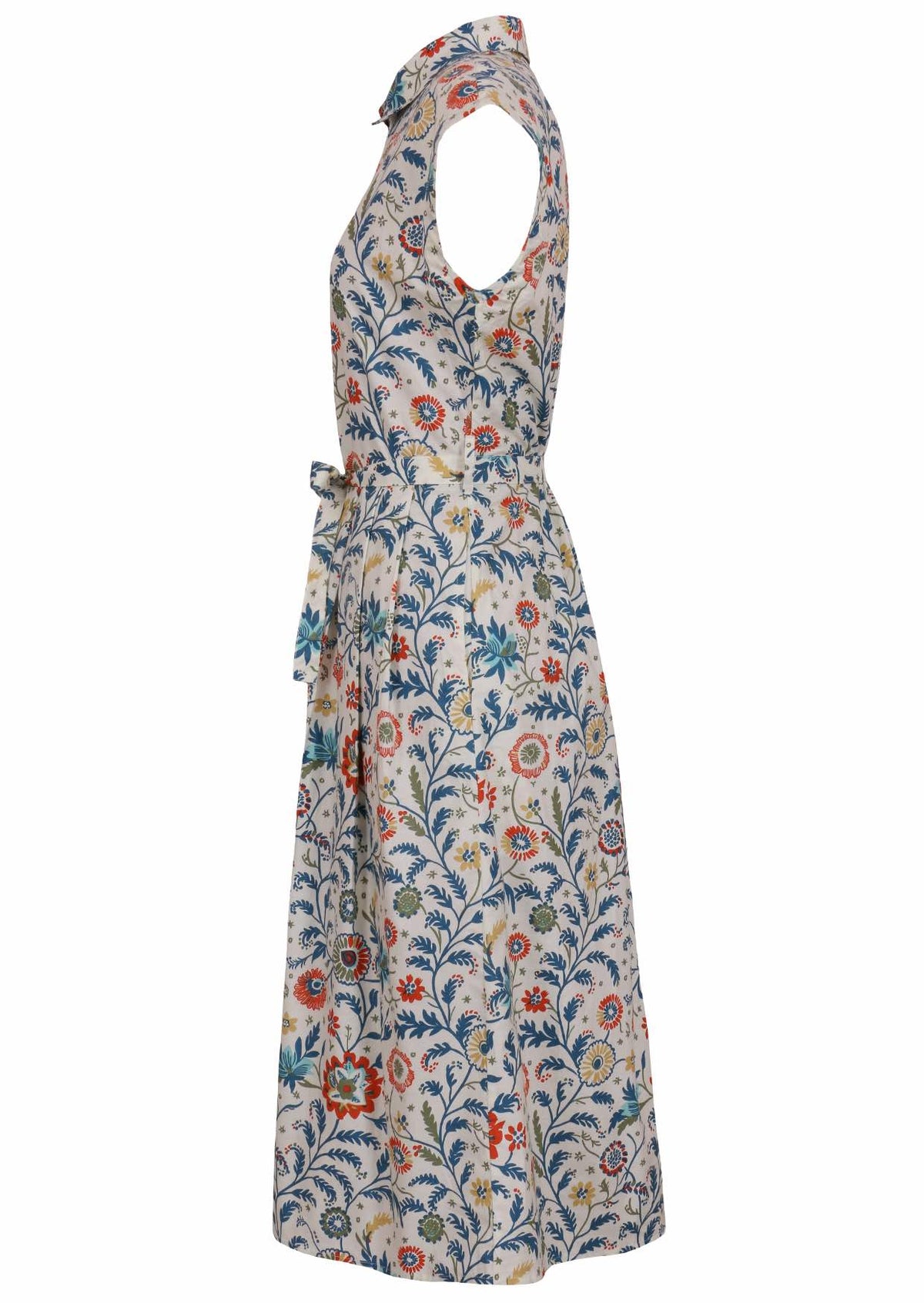 Side view of white based floral print cotton dress with pockets.