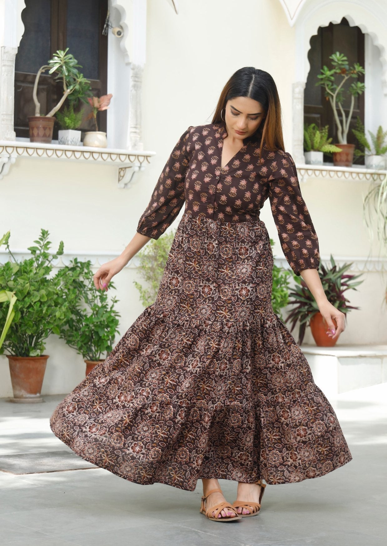 Model in 100% cotton maxi dress with 3/4 sleeves, pockets and 3 tiered flowy skirt.