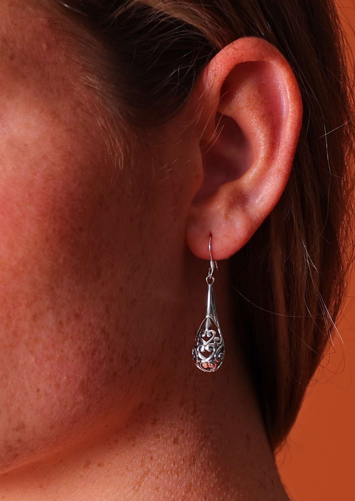 Sterling silver teardrop shape earrings with filigree detail forming small hearts