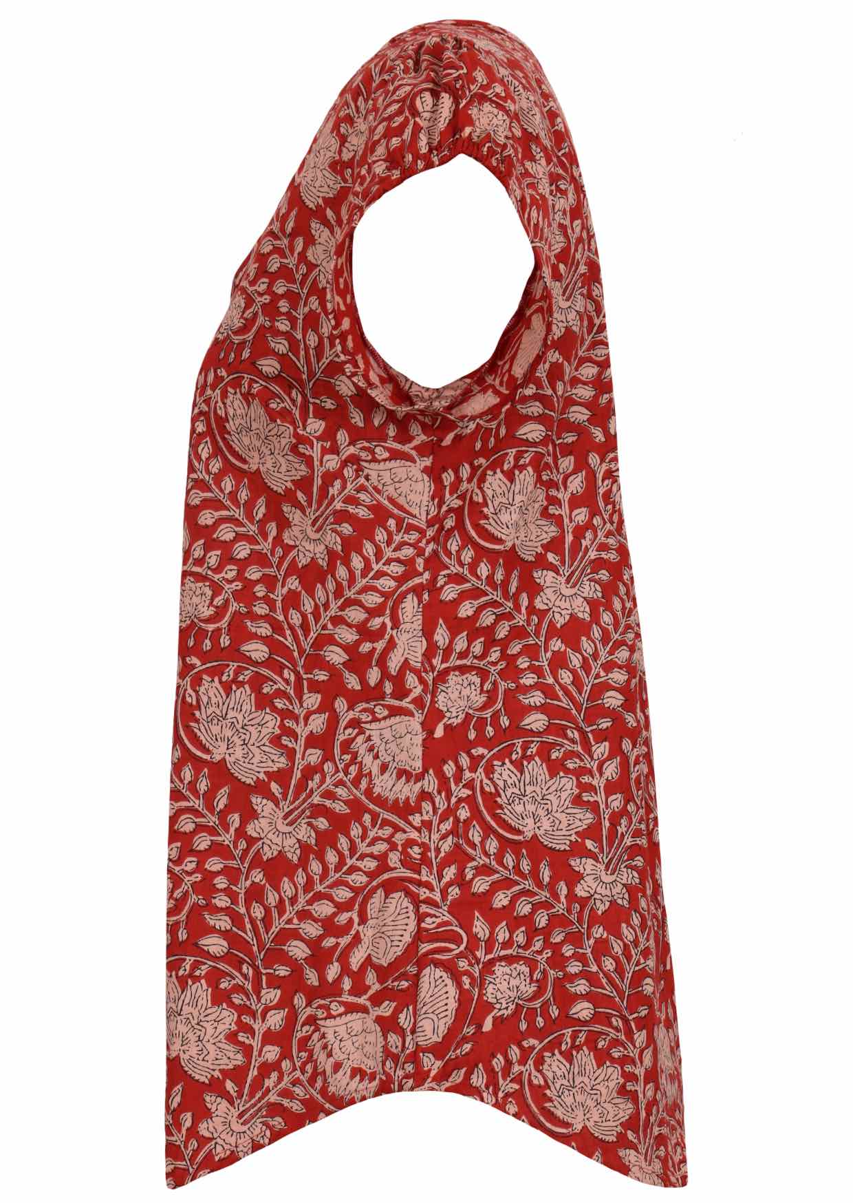 Side view of red based floral print cotton top with cap sleeves.