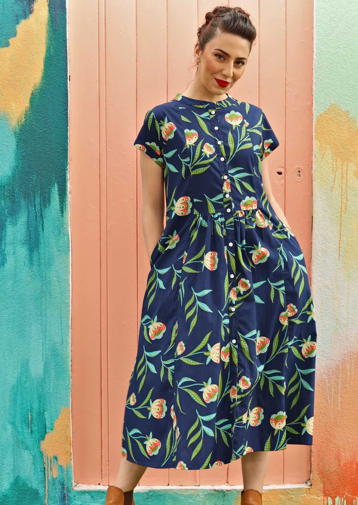 Model wears a dress with a mandarin collar.