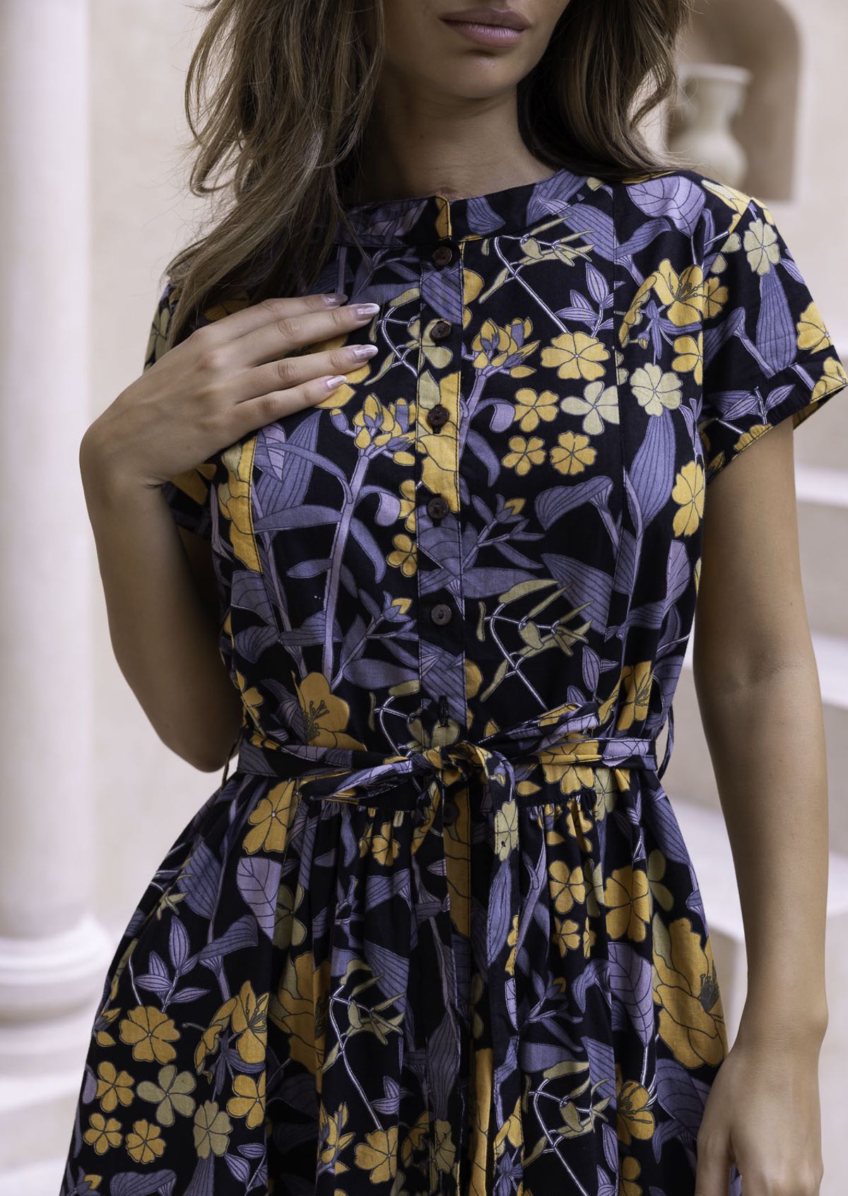 100% cotton button through floral dress with removable waist tie, waist pleats and short sleeves.