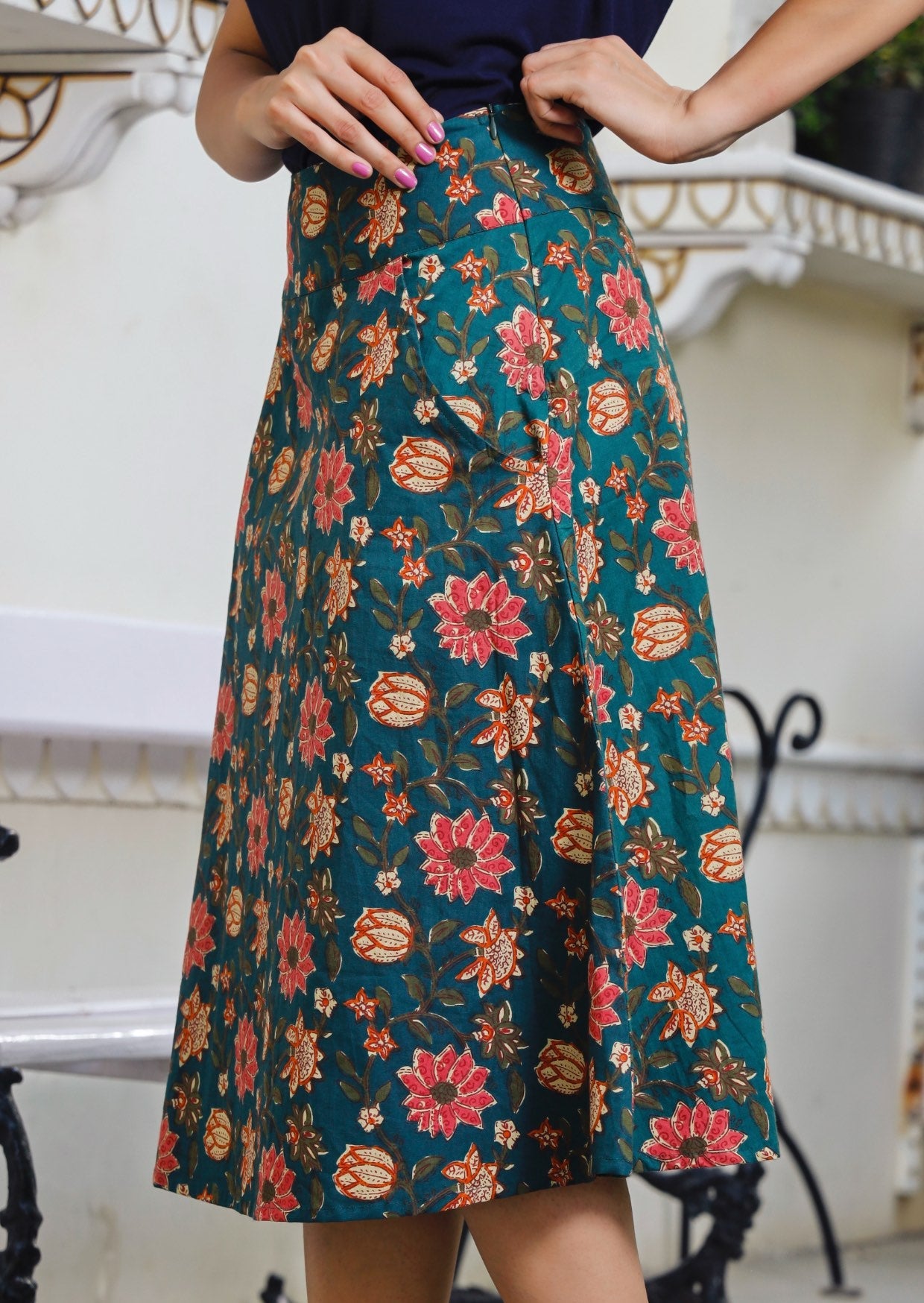 Side pose of model in A line cotton skirt with pocket and hidden side zip.