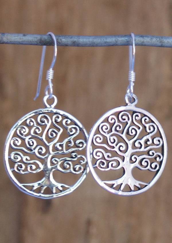 Swirly branches reaching for a circular frame