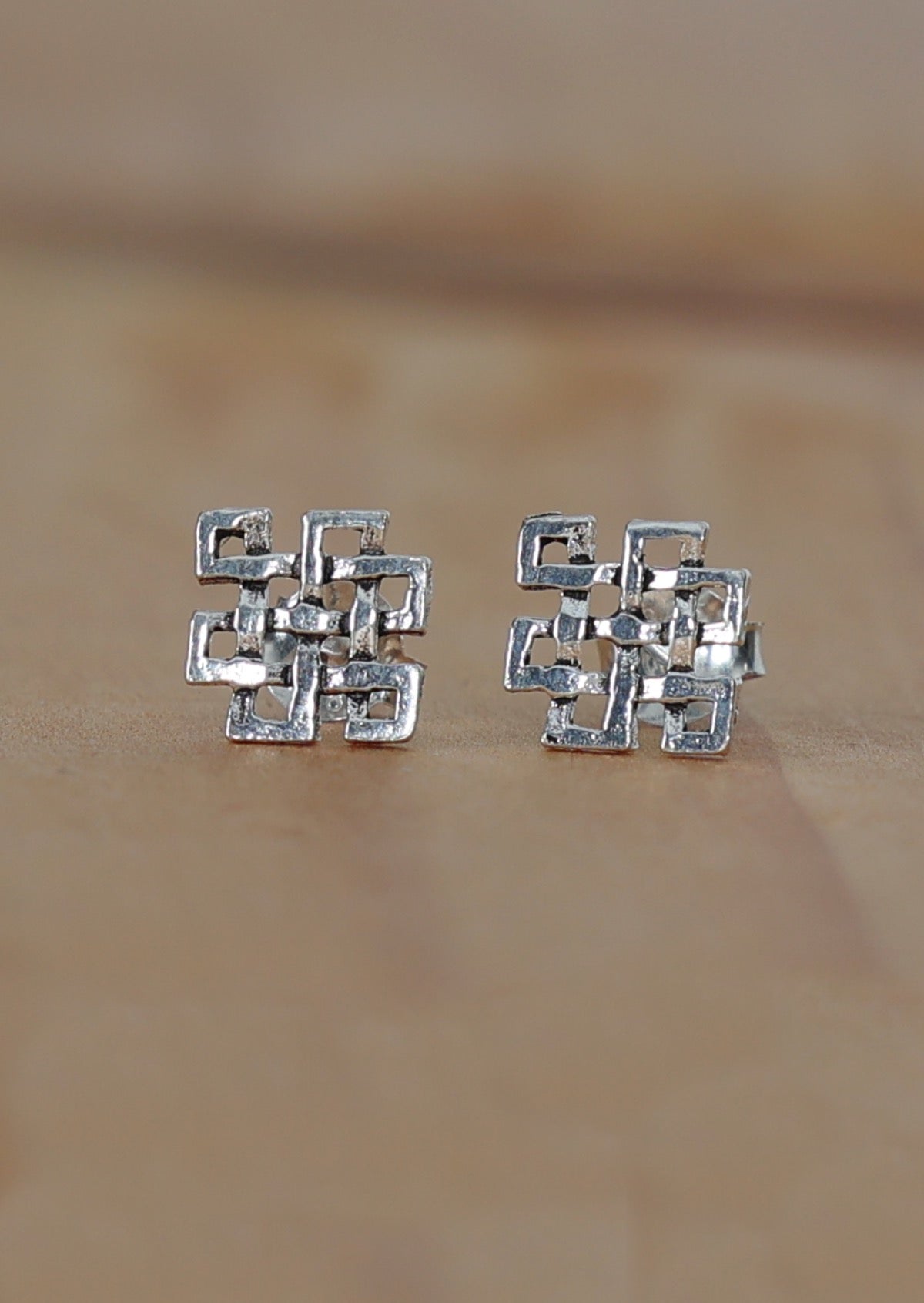 Sterling silver endless knot design stud earrings