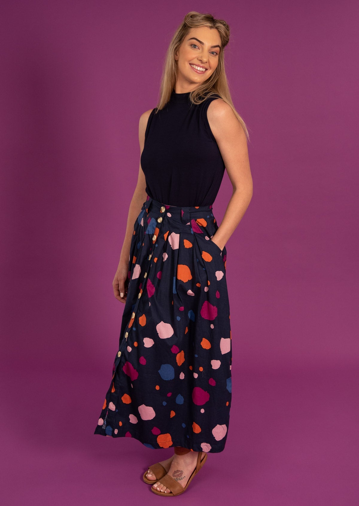 model wears 100% cotton shin length skirt with belt loop and pockets.