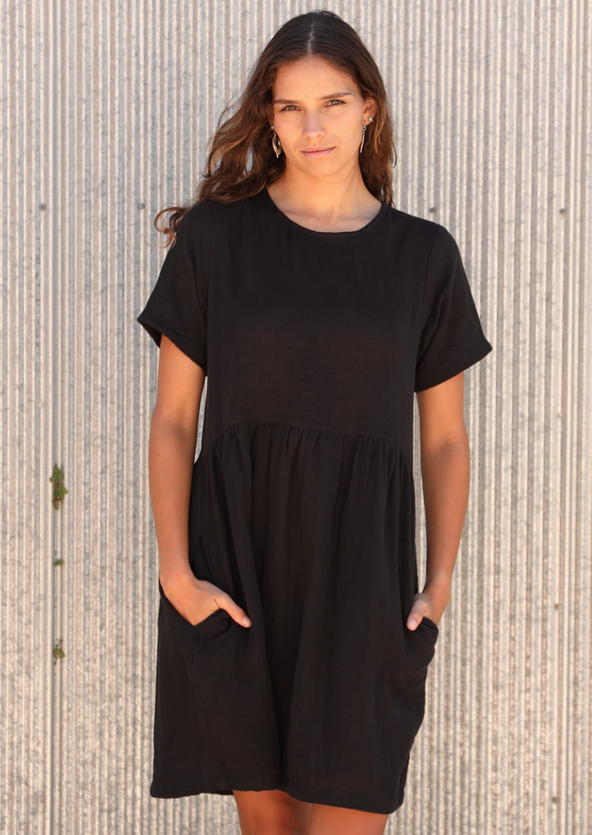 Model in 100% cotton dress with side pockets