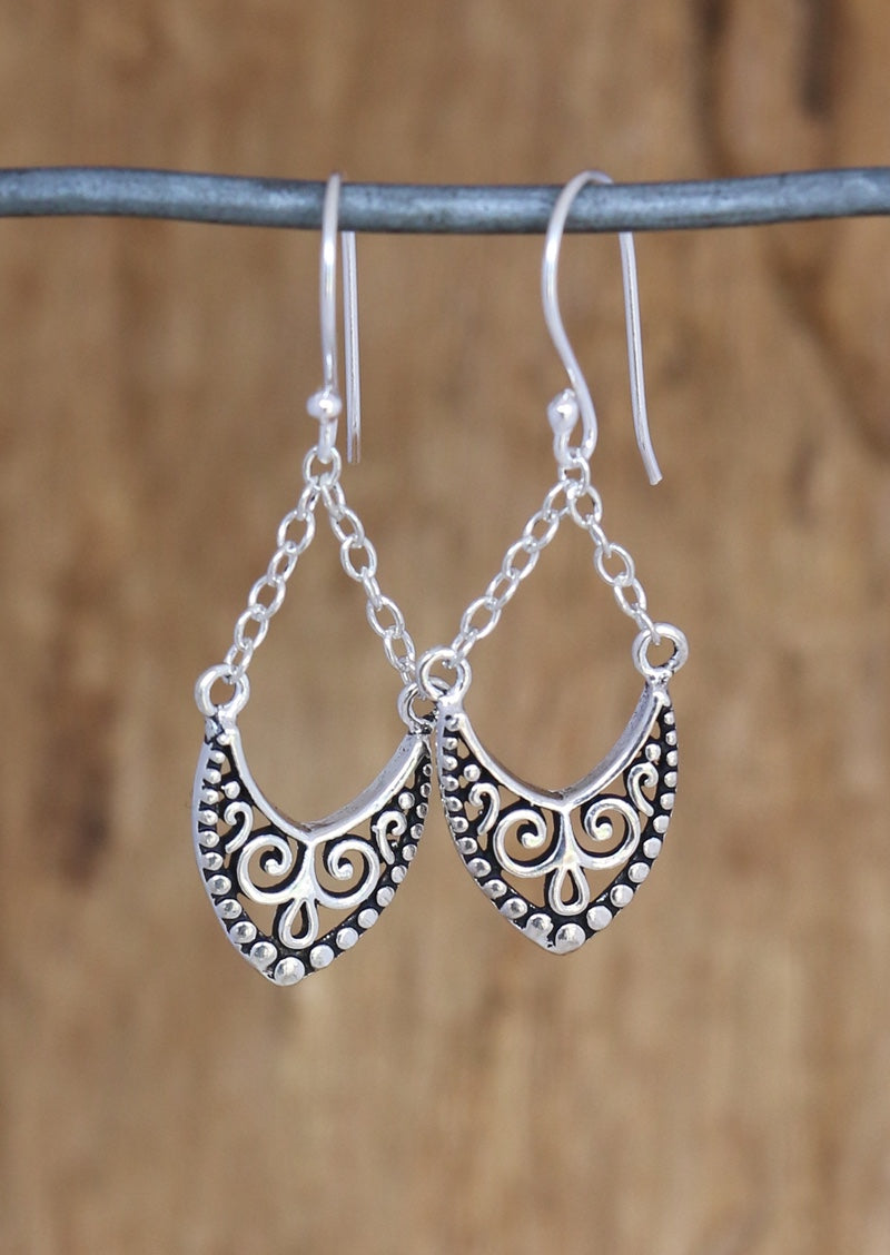 Sterling silver hook earrings with cutout shield that hangs from delicate chain