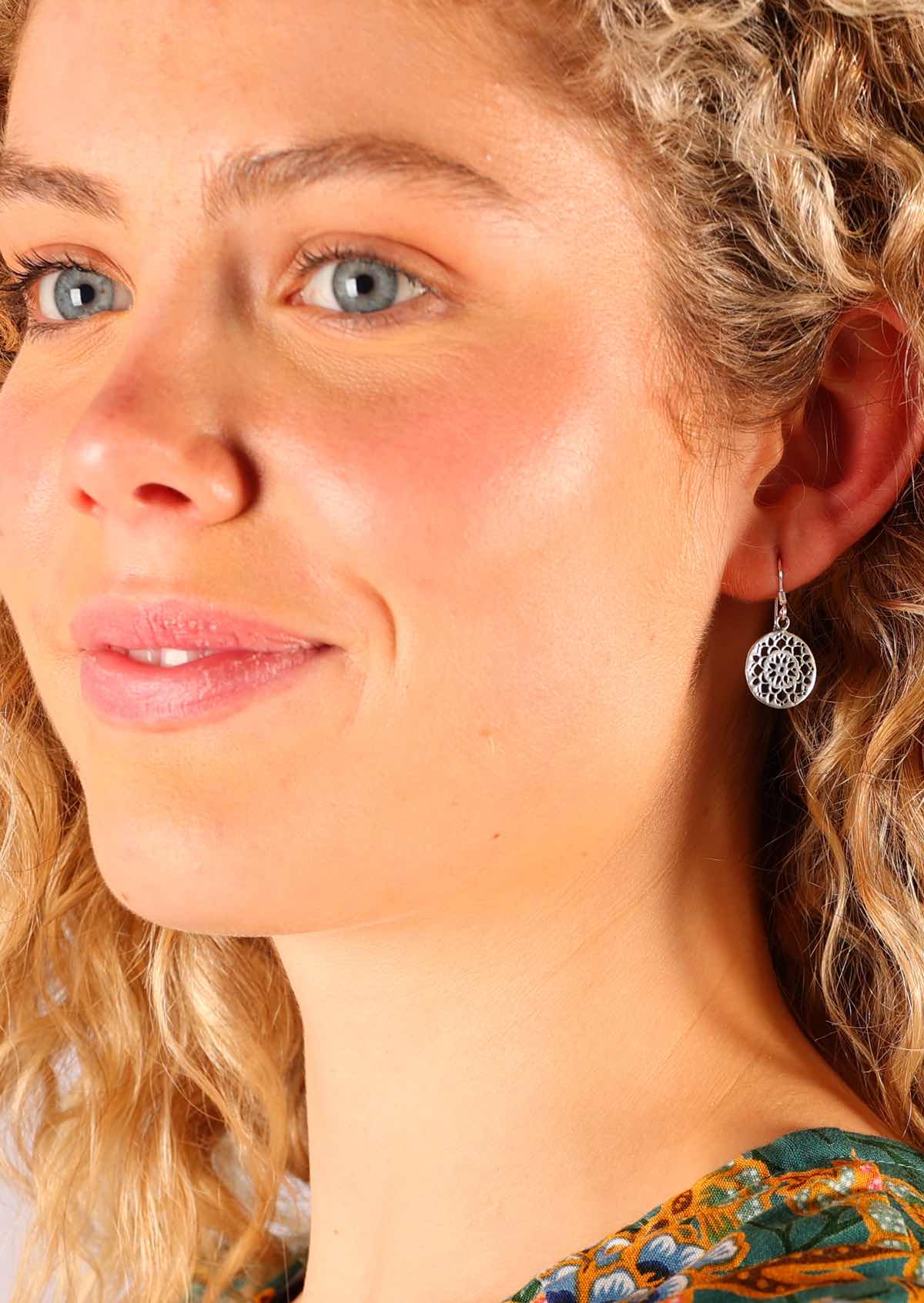 Sweet mandala cutout design in these sterling silver earrings