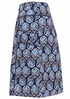 Side image of navy based floral print, A line cotton skirt with wide piped waistband, pockets and hidden side zipper