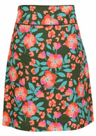 Back image of a above knee length olive green cotton skirt with piped detailing, pockets and a side zipper