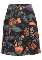 100% cotton above knee A-line skirt with piped details, pockets and hidden side zip in queen protea print on black base