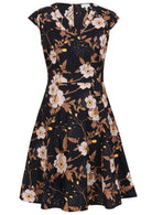 V-neck cotton dress with print featuring white blooms, tan foliage, and warm buttercup highlights on a black base.
