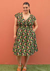 Plus size model wearing retro style cotton dress in black and green