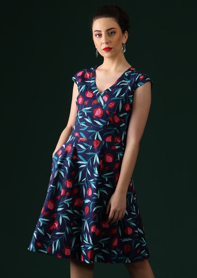 Model wears 100% cotton fruit print dress.