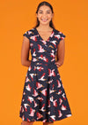 Woman wearing 50's style cotton pelican print dress