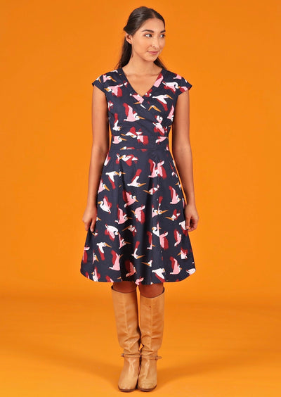Woman wearing  cotton dark blue pelican print retro dress