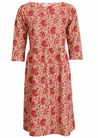 Cream based, knee length cotton dress with wide round neckline and 3/4 sleeves.