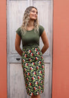 Model wears cotton midi skirt with back pockets