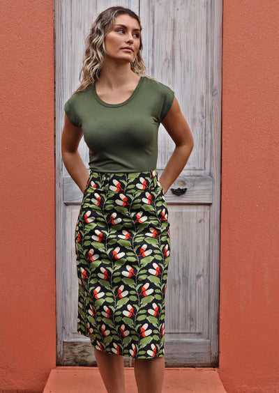 Model wears Belt Loop Skirt Oak green and black print cotton midi A-line skirt with belt loops, side zip and back pockets | Karma East Australia