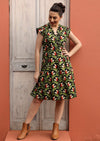 Model wears knee length cotton retro inspired dress