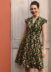 Model wears retro inspired cotton dress with V-neckline