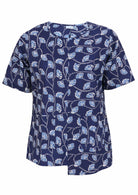Navy based floral print cotton relaxed fit top with an asymmetrical hem line and front pockets