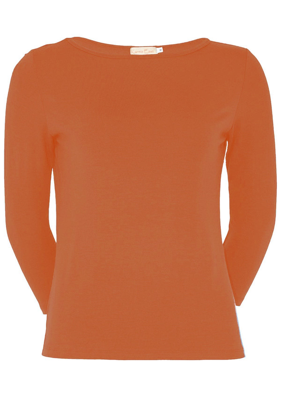 Model wears 100% stretch rayon top with 3/4 sleeves. This brick orange top features a boat neckline and sits on the hip.