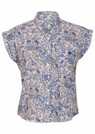 White based blue floral print cotton shirt on a mannequin against a white background