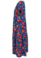 Side view of cotton short sleeved midi length dress with empire waist and tiered skirt in royal blue based floral print
