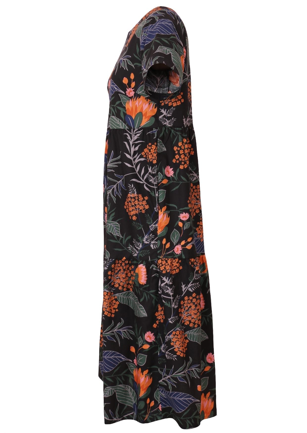 Side view of cotton short sleeved midi length dress with empire waist and tiered skirt in black based bold botanical print 
