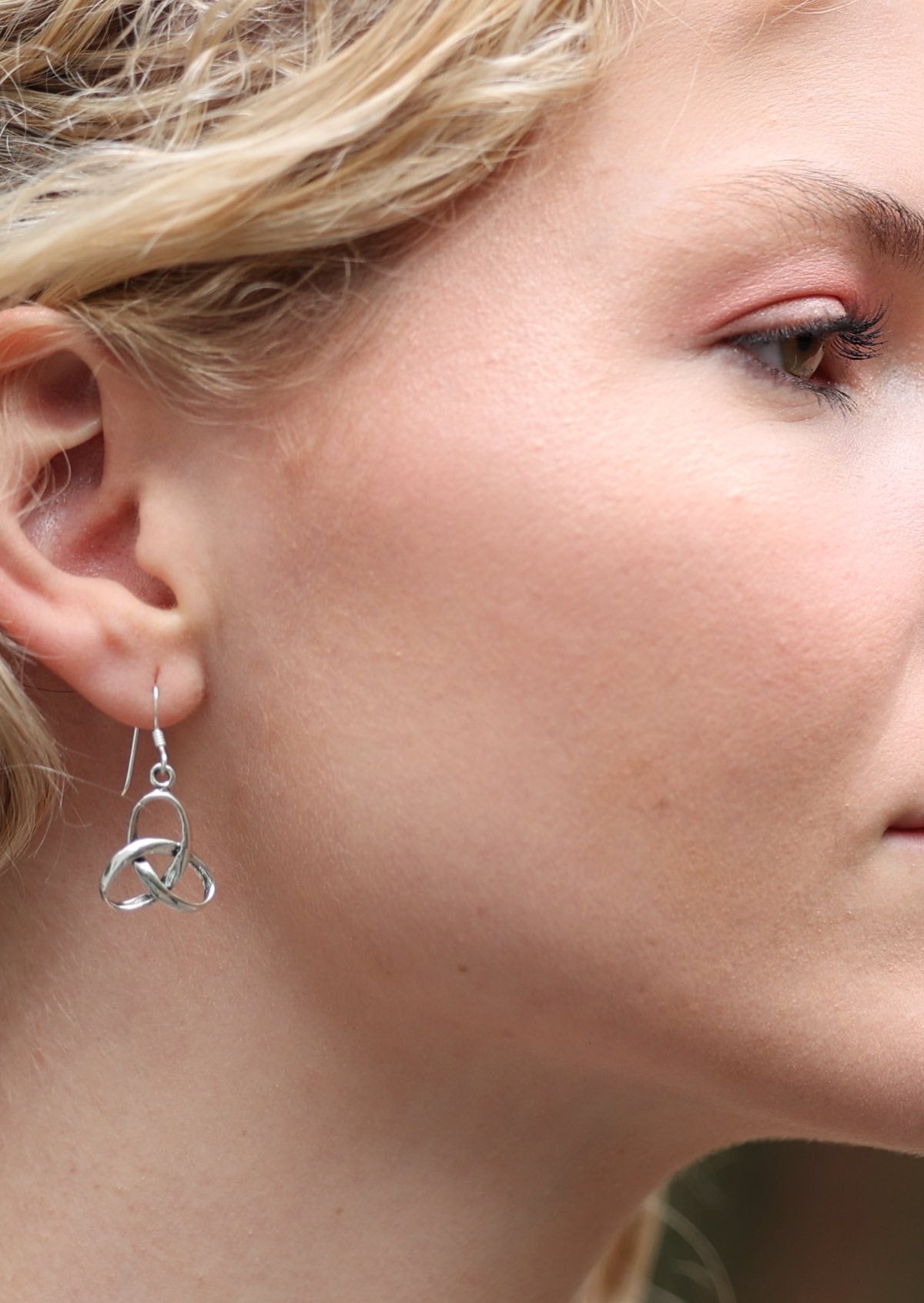 Silver hook earrings with continuous knot