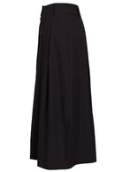 Side view of 100% cotton black maxi skirt with belt loops, side pockets and box pleats at front and back 