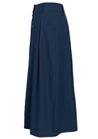 Side view of ankle length cotton skirt in dark blue with belt loops, pockets and box pleats in front and back