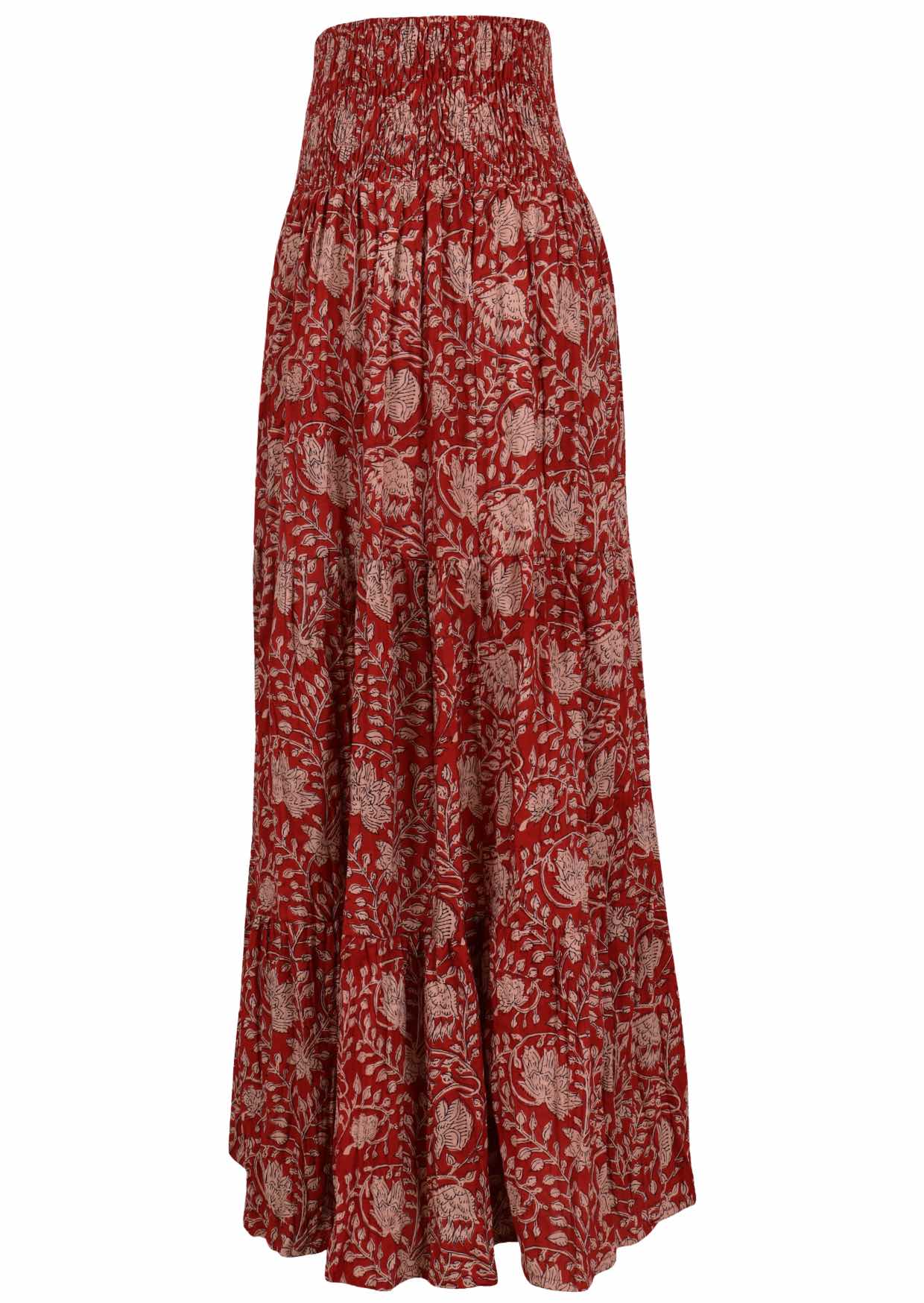 Side view of  patterned cotton skirt on a red base floral print with elasticised waistband.
