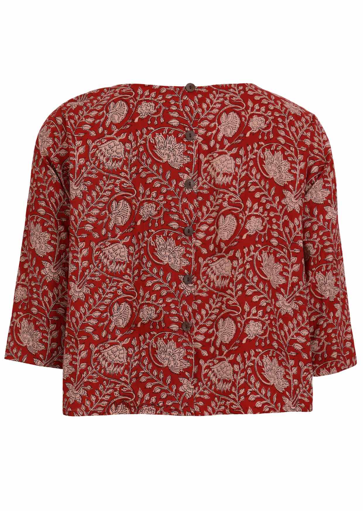Back view of red based floral top features round neckline and 3/4 sleeves with buttons down the back.