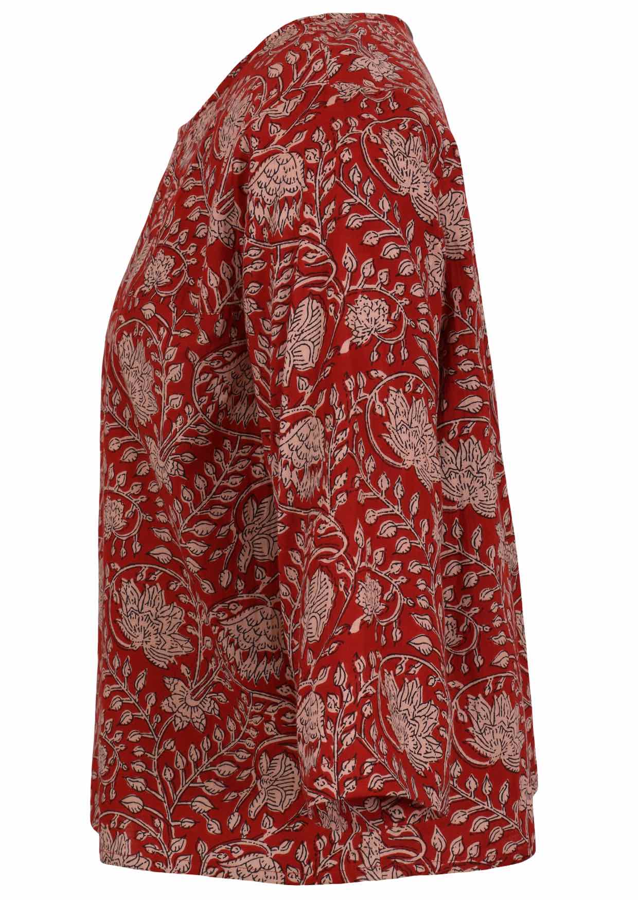 Side view of red based floral top with round neckline and 3/4 sleeves