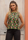 Model wears green and black sleeveless cotton top