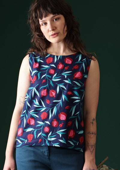 Model wears cotton top with fruit print.
