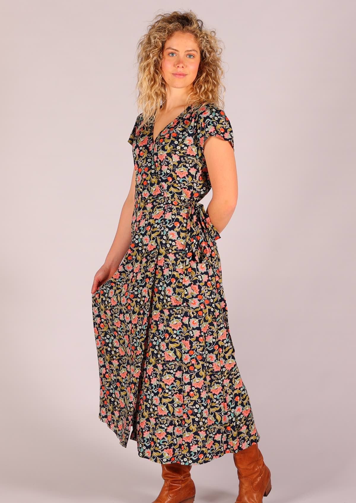 Model wearing navy floral non stretch rayon wrap maxi sundress 