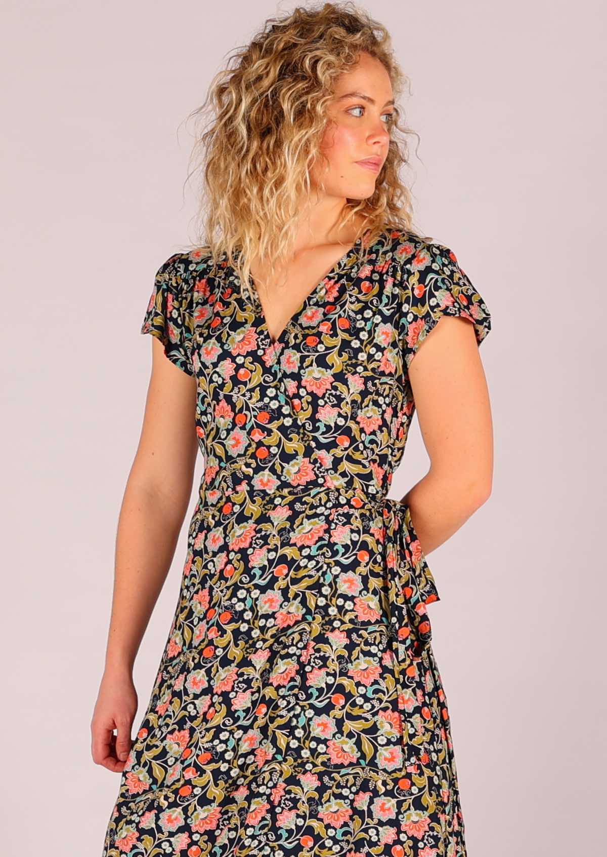 close up of Model wearing navy floral rayon wrap maxi sundress 